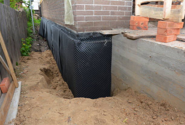 SJ Waterproofing Pros technician performing targeted Interior Drainage System assessment in Fairfield, AL